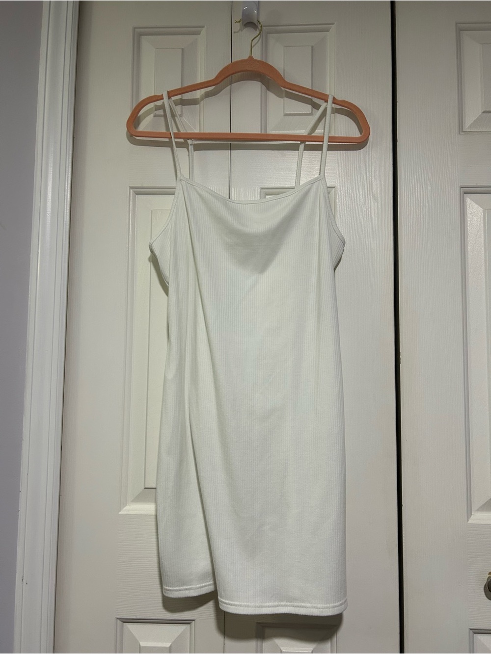 White ribbed knit mini dress with spaghetti straps